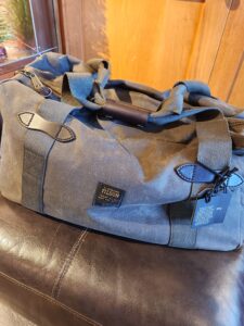 Shop Filson Tin Cloth Medium Duffle Bag in Otter Green in Lubbock TX